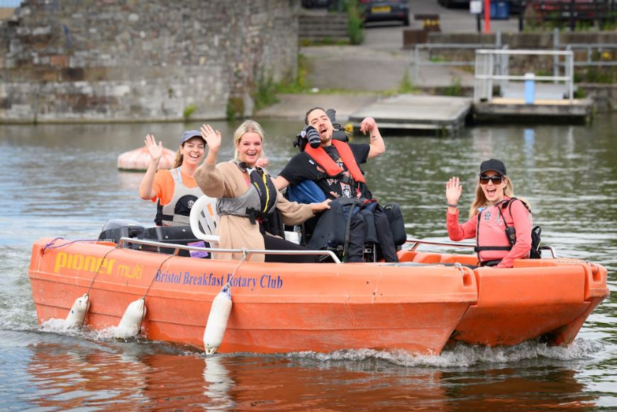 4 people on a boat